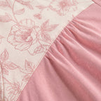 Bata Orquídea, la tela: canesú crema estampado, pespunte y frunce de la falda